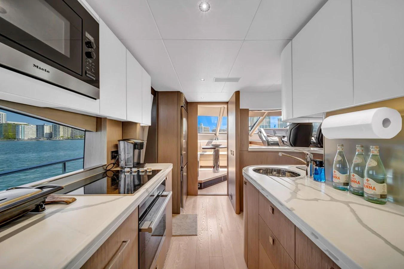The galley features modern appliances and a sleek design with ample counter space and a view of the water. aboard SUNSEEKER Yacht for Sale
