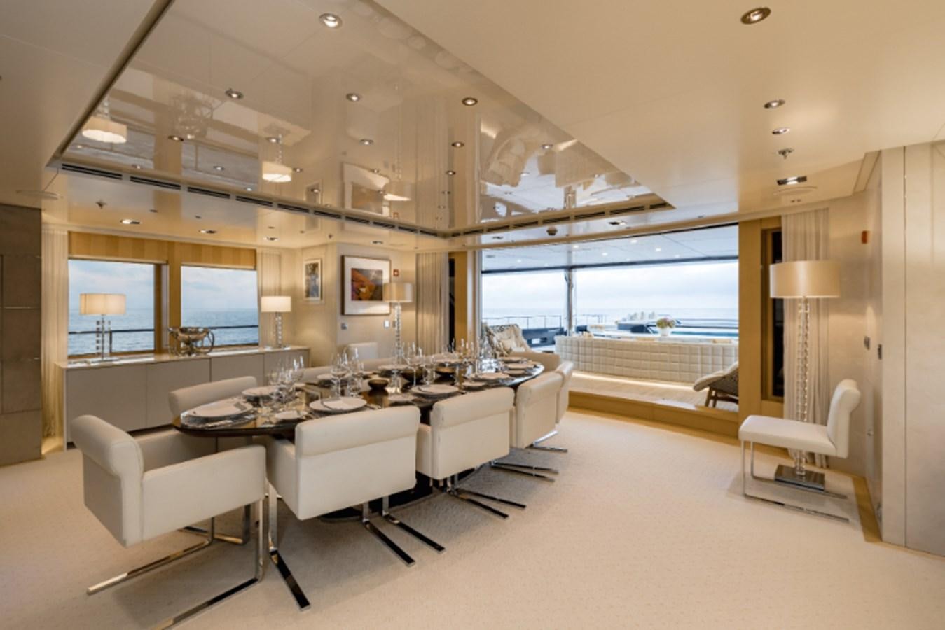 a large living room with a large window aboard LOON Yacht for Sale