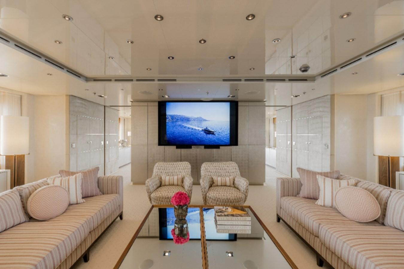 a living room with a large screen aboard LOON Yacht for Sale
