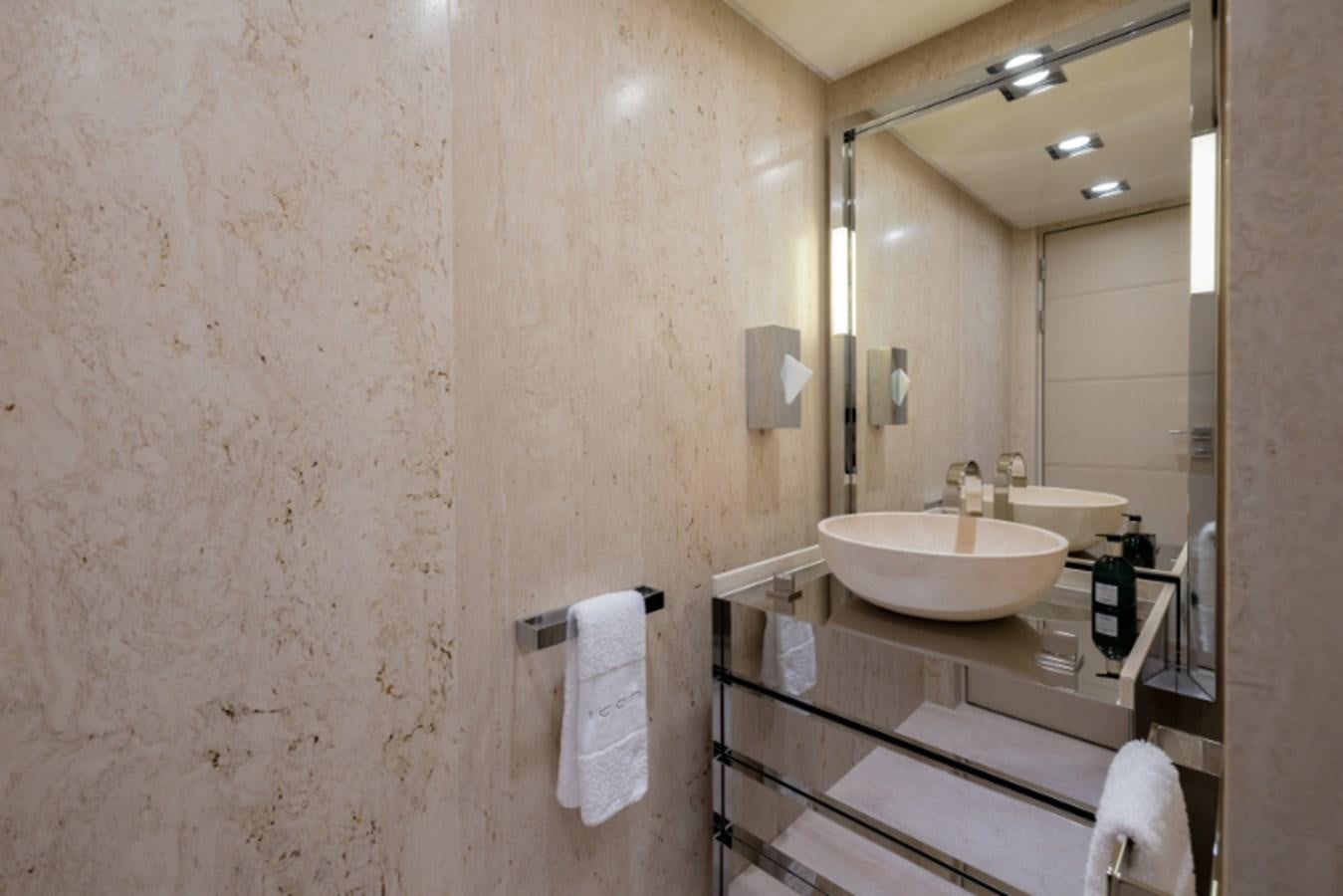 a bathroom with a sink and mirror aboard LOON Yacht for Sale