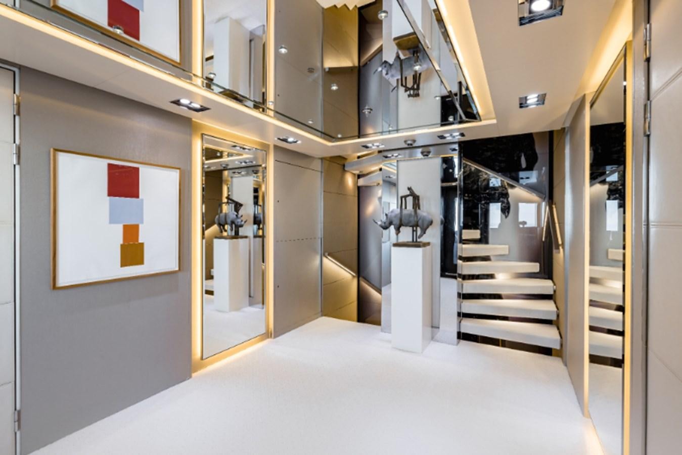 a room with a staircase and a window aboard LOON Yacht for Sale