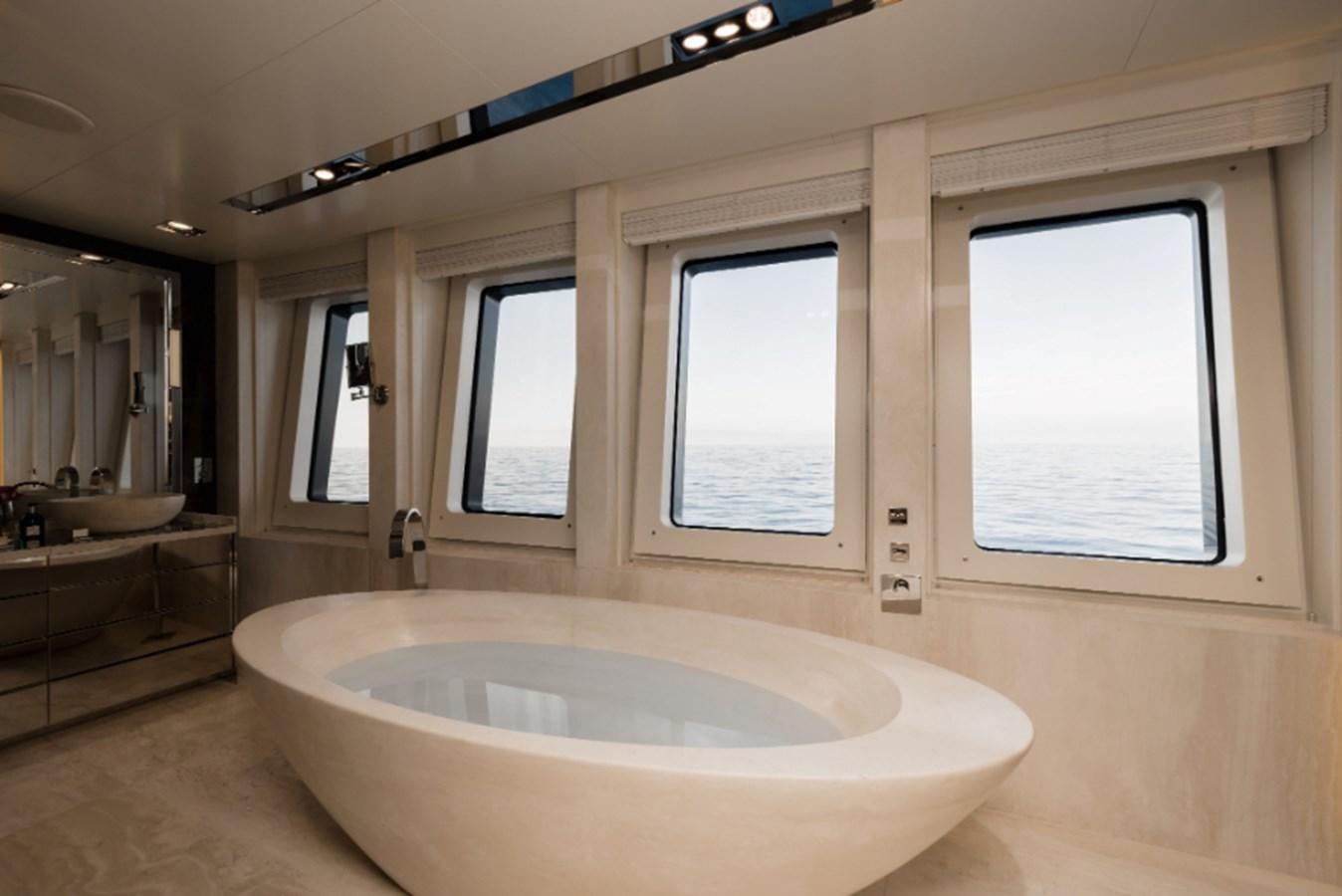 a bathroom with a tub aboard LOON Yacht for Sale