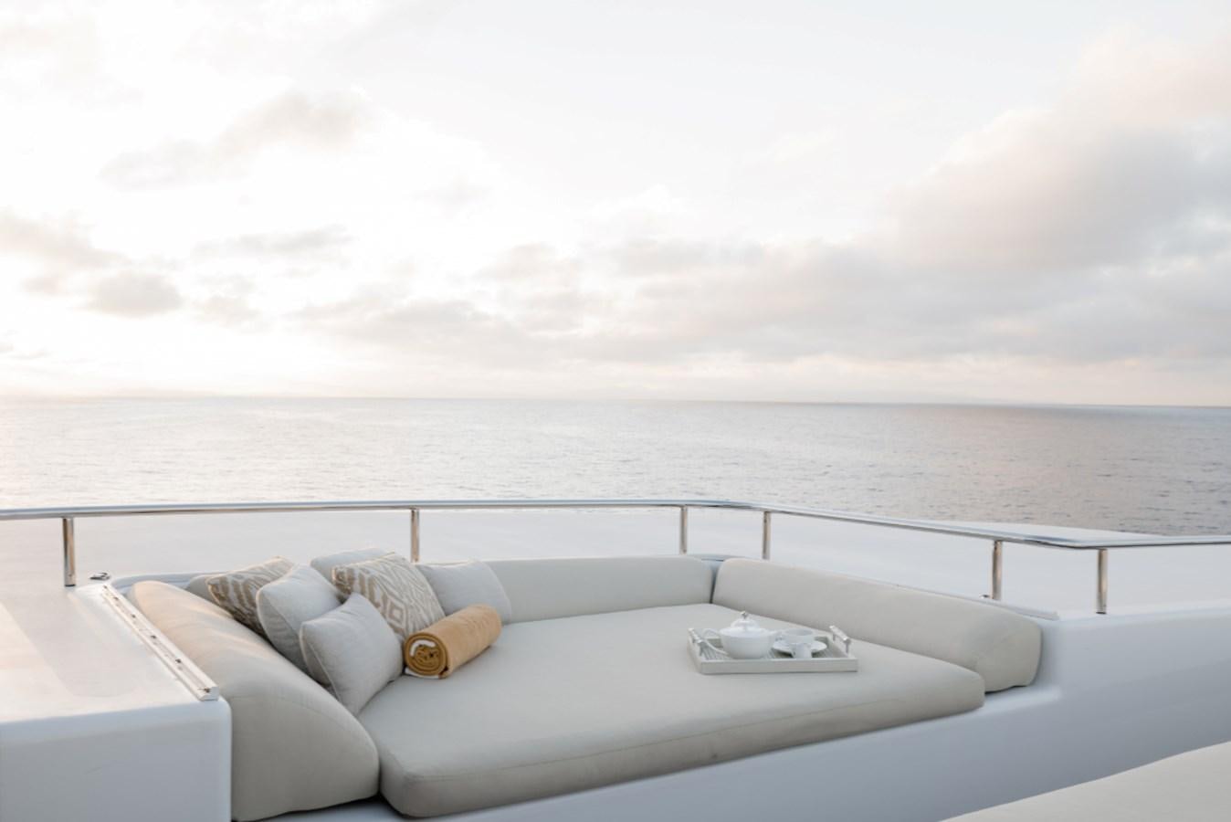 a bed with a tray on it aboard LOON Yacht for Sale