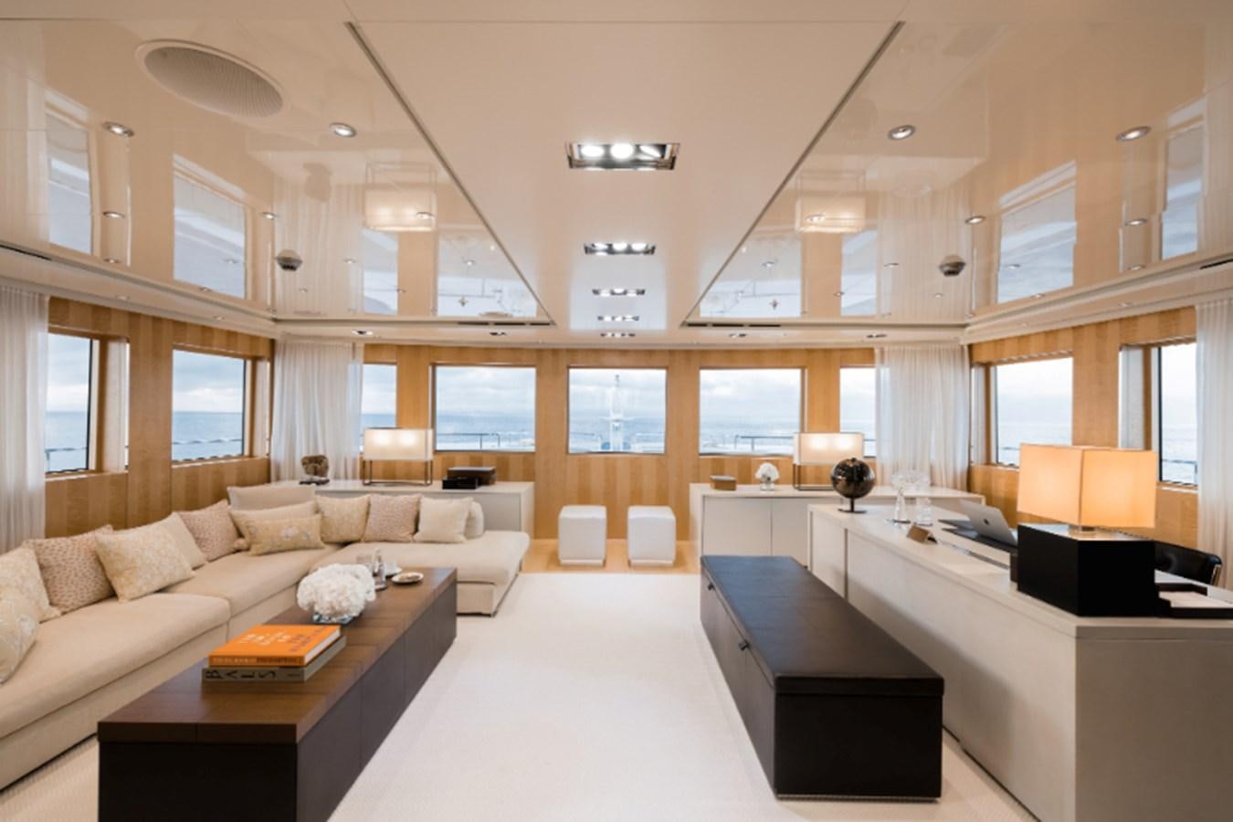 a living room with a couch and a table aboard LOON Yacht for Sale