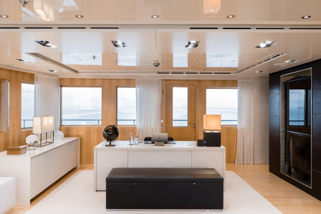 a large room with a couch and a table aboard LOON Yacht for Sale