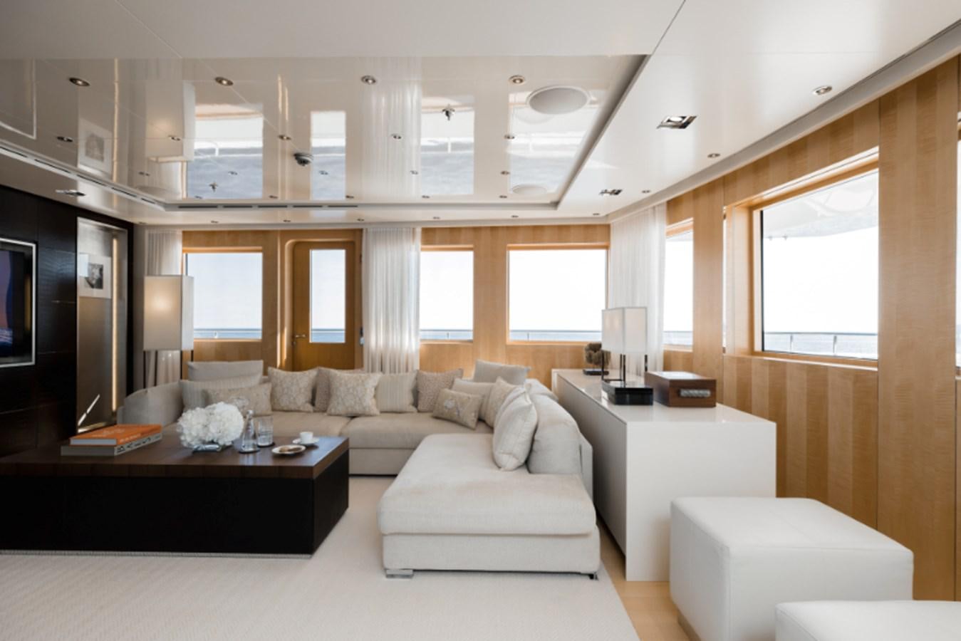 a living room with a couch and a tv aboard LOON Yacht for Sale
