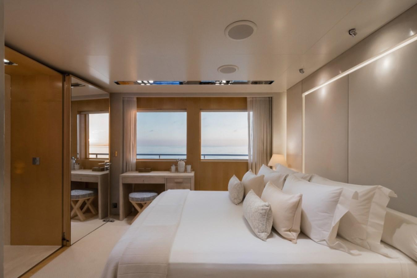 a bed in a room aboard LOON Yacht for Sale