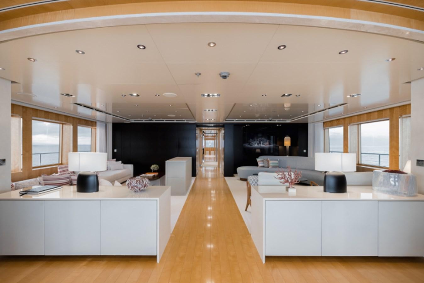 a large kitchen with white cabinets aboard LOON Yacht for Sale