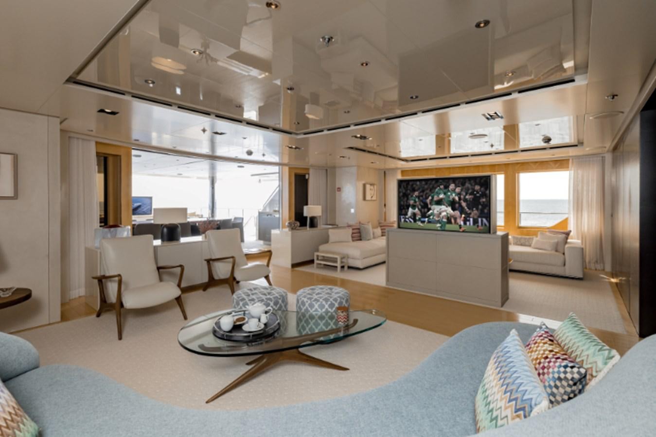 a living room with a large screen aboard LOON Yacht for Sale