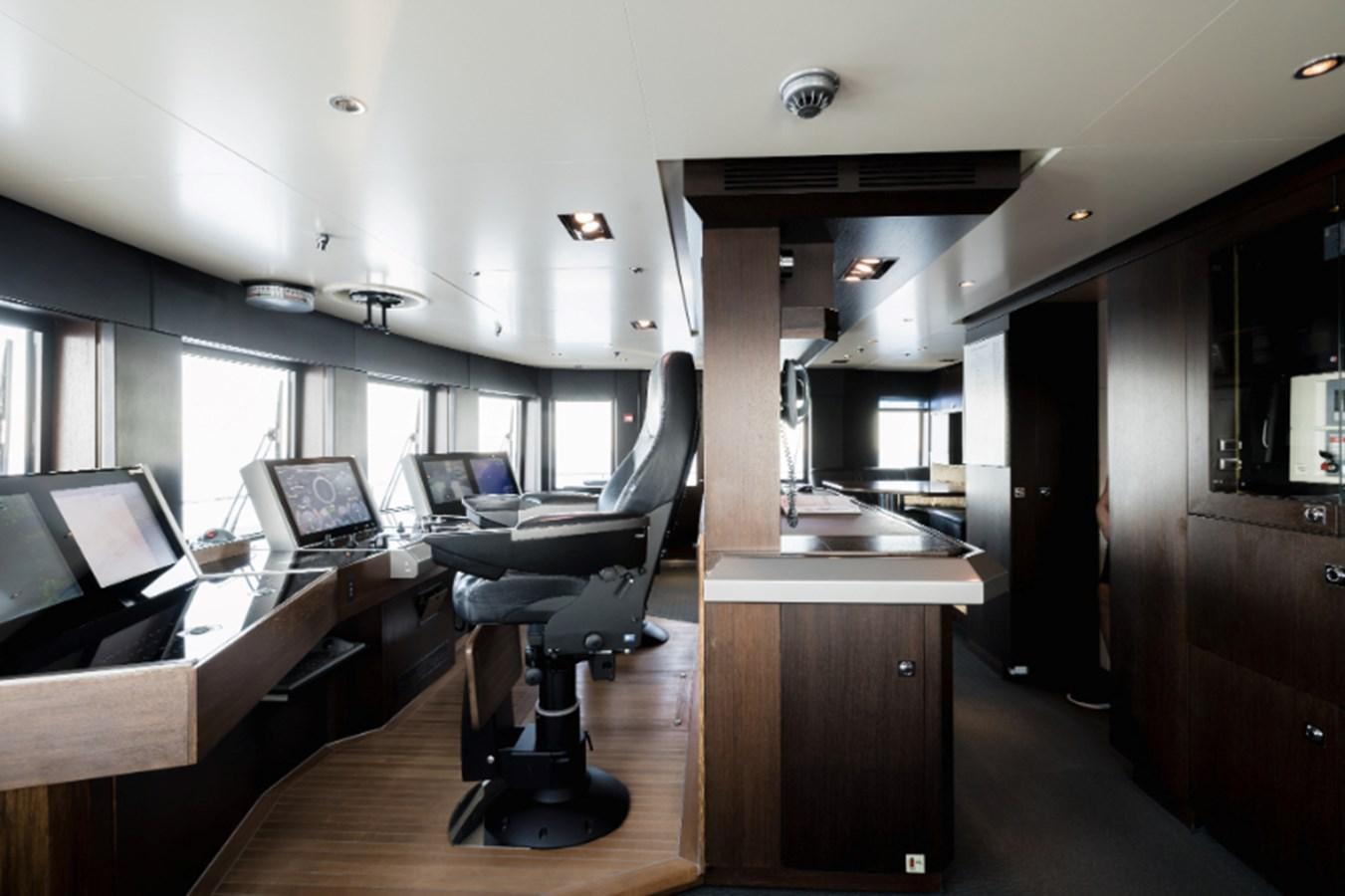 a room with a desk and a computer aboard LOON Yacht for Sale