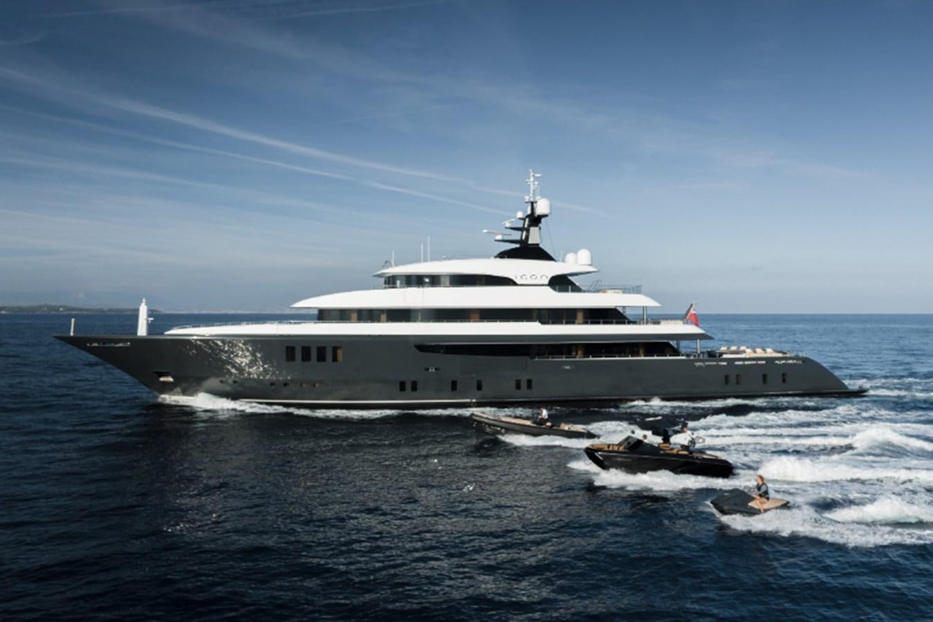 a large ship in the water aboard LOON Yacht for Sale