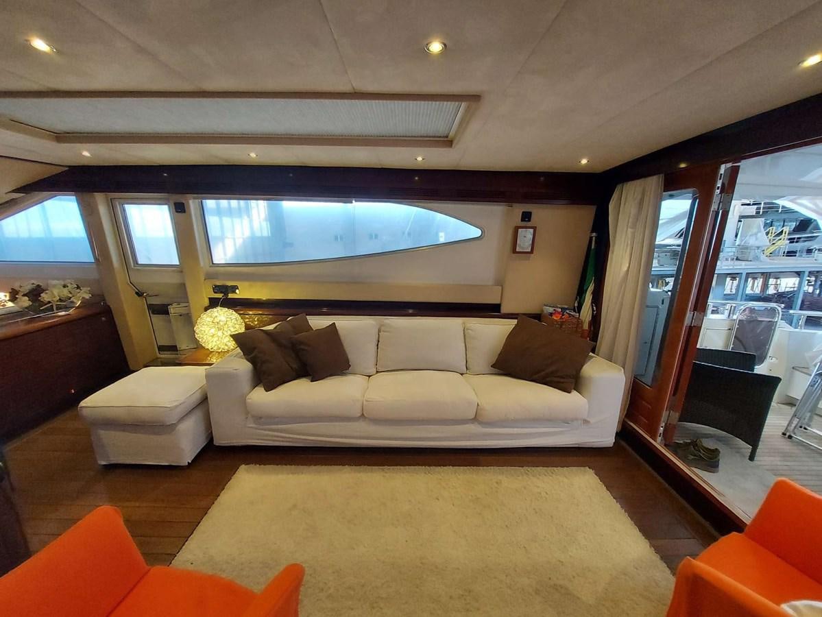 a living room with a large window aboard LADY ROSE Yacht for Sale