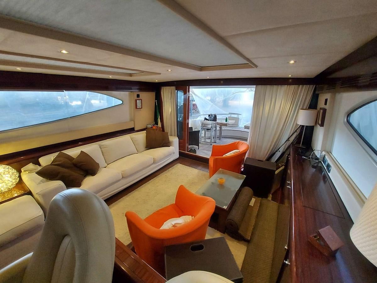 a living room with a large window aboard LADY ROSE Yacht for Sale