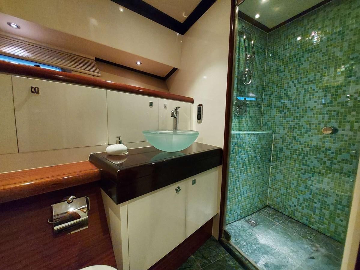 a bathroom with a sink and a shower aboard LADY ROSE Yacht for Sale