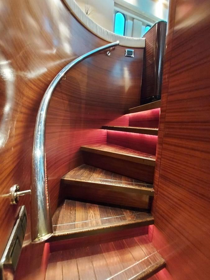 a staircase with a metal railing aboard LADY ROSE Yacht for Sale