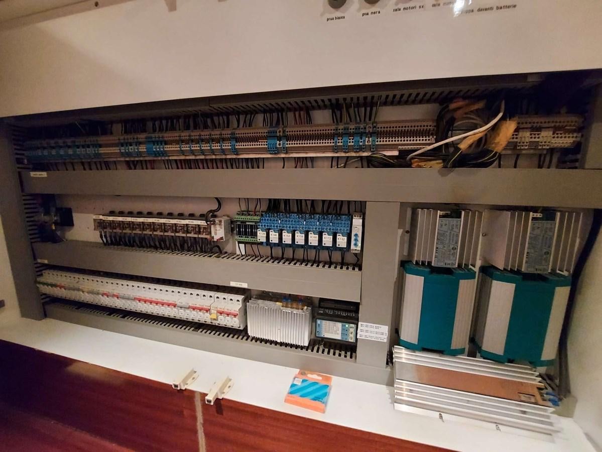 a shelf with a variety of electronics aboard LADY ROSE Yacht for Sale