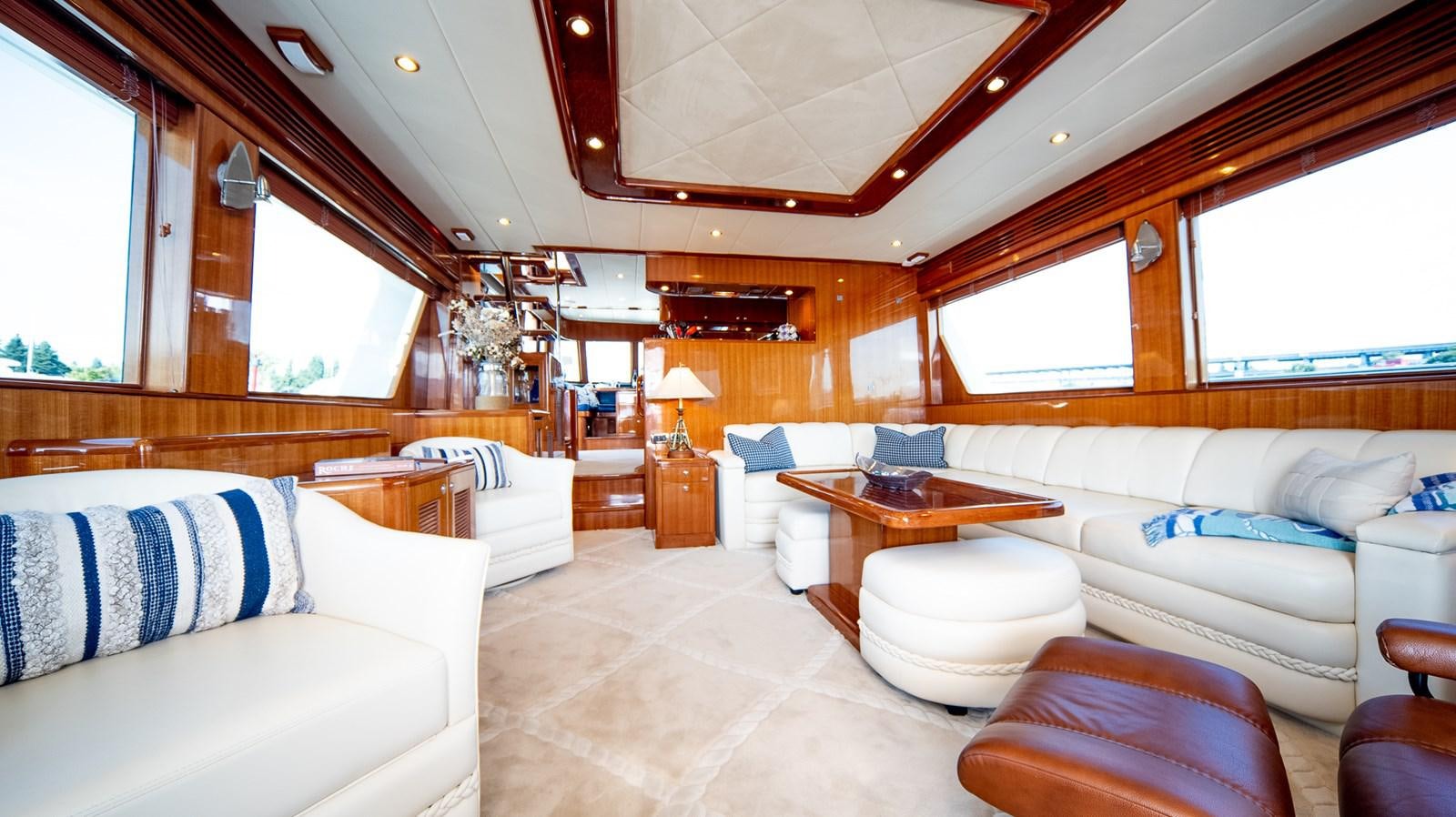 a living room with a couch and a table aboard SEA CZAR Yacht for Sale