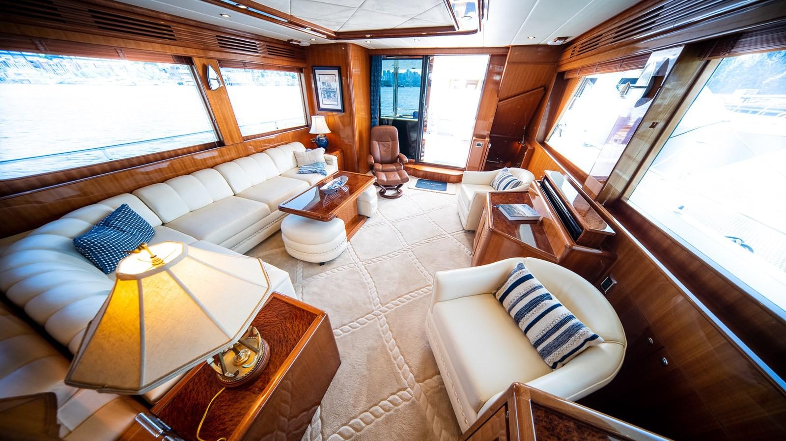 a room with a couch and a table and chairs aboard SEA CZAR Yacht for Sale