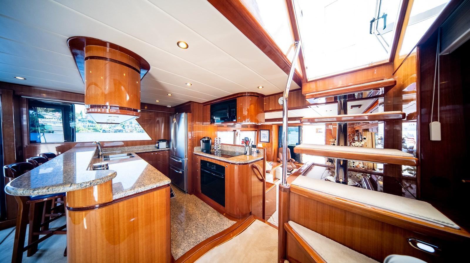 a kitchen with wooden cabinets aboard SEA CZAR Yacht for Sale