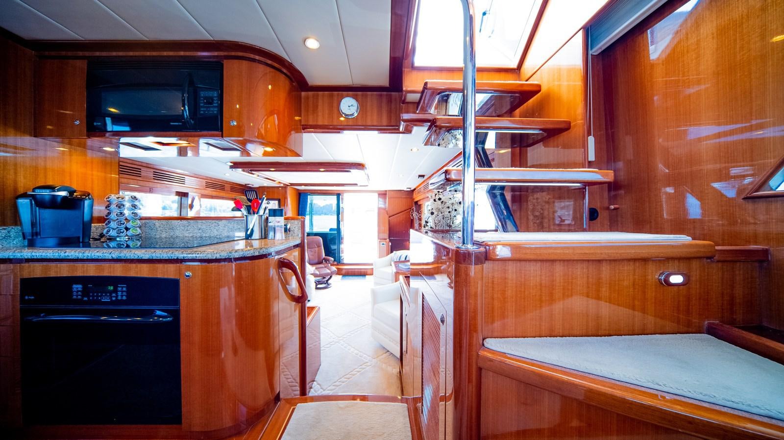a kitchen with wooden cabinets aboard SEA CZAR Yacht for Sale