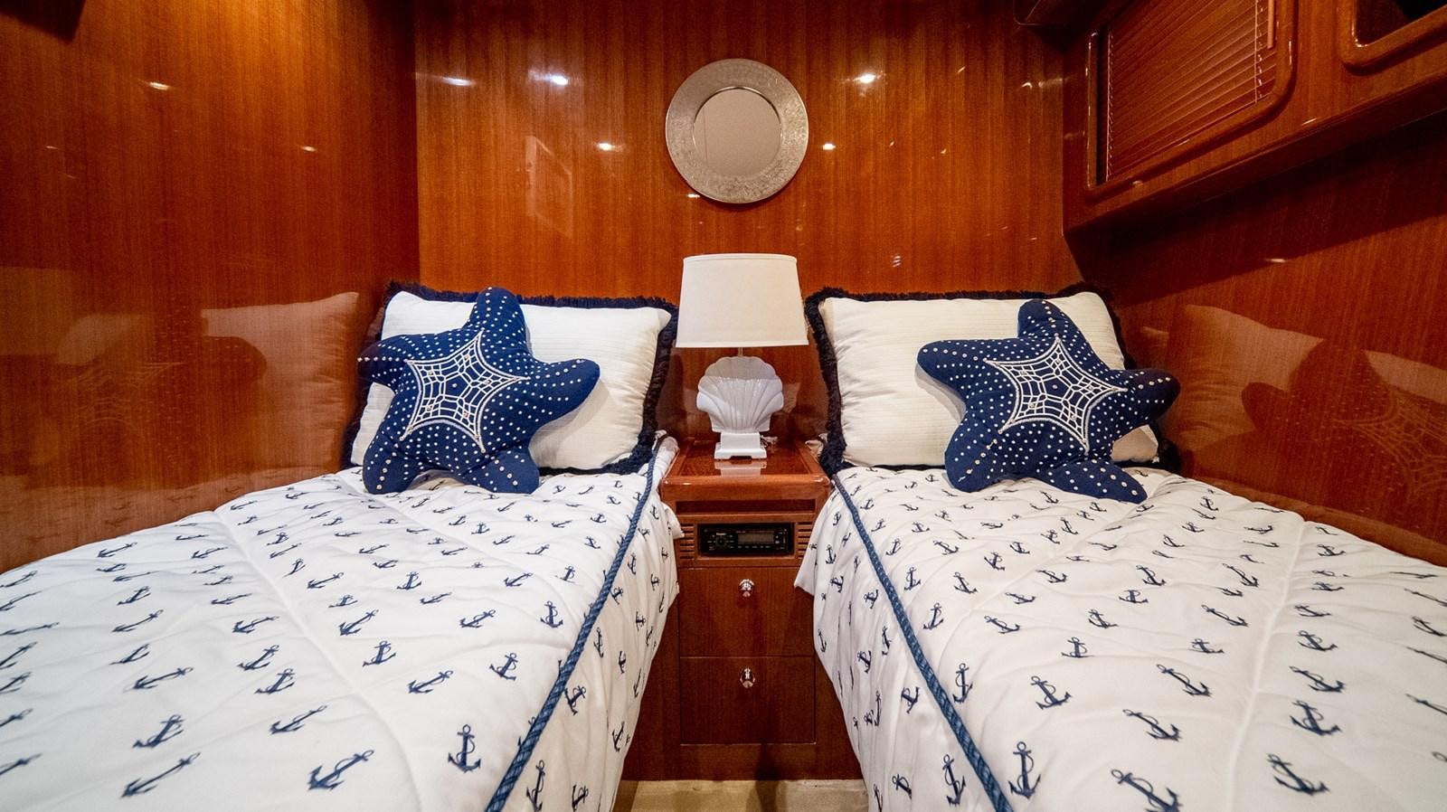 a couple of beds in a room aboard SEA CZAR Yacht for Sale