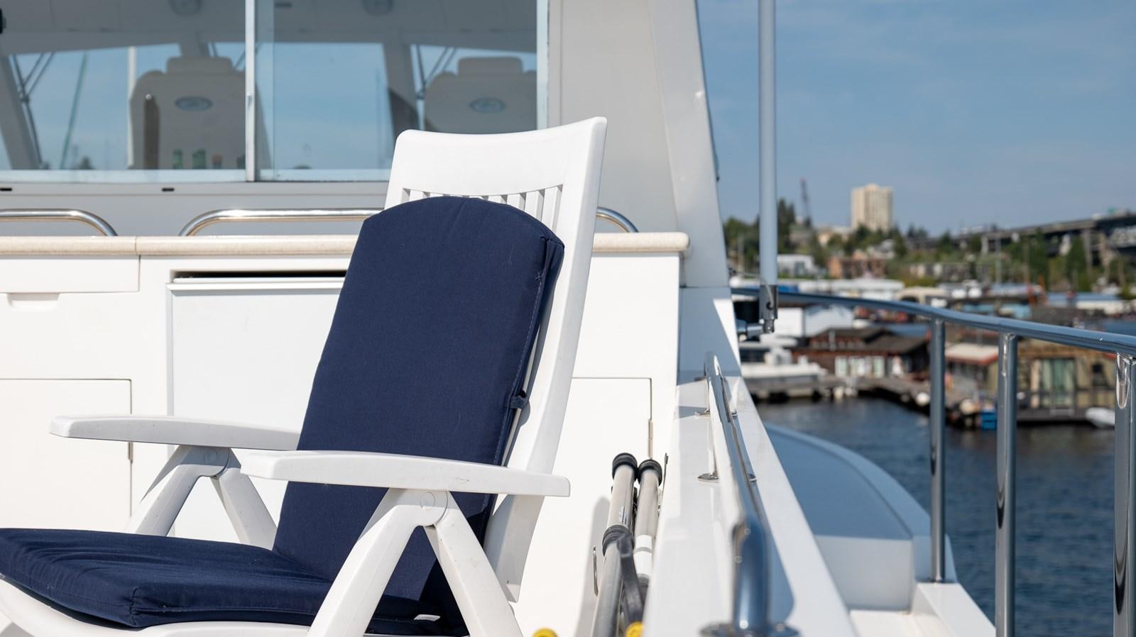 a white chair on a boat aboard SEA CZAR Yacht for Sale