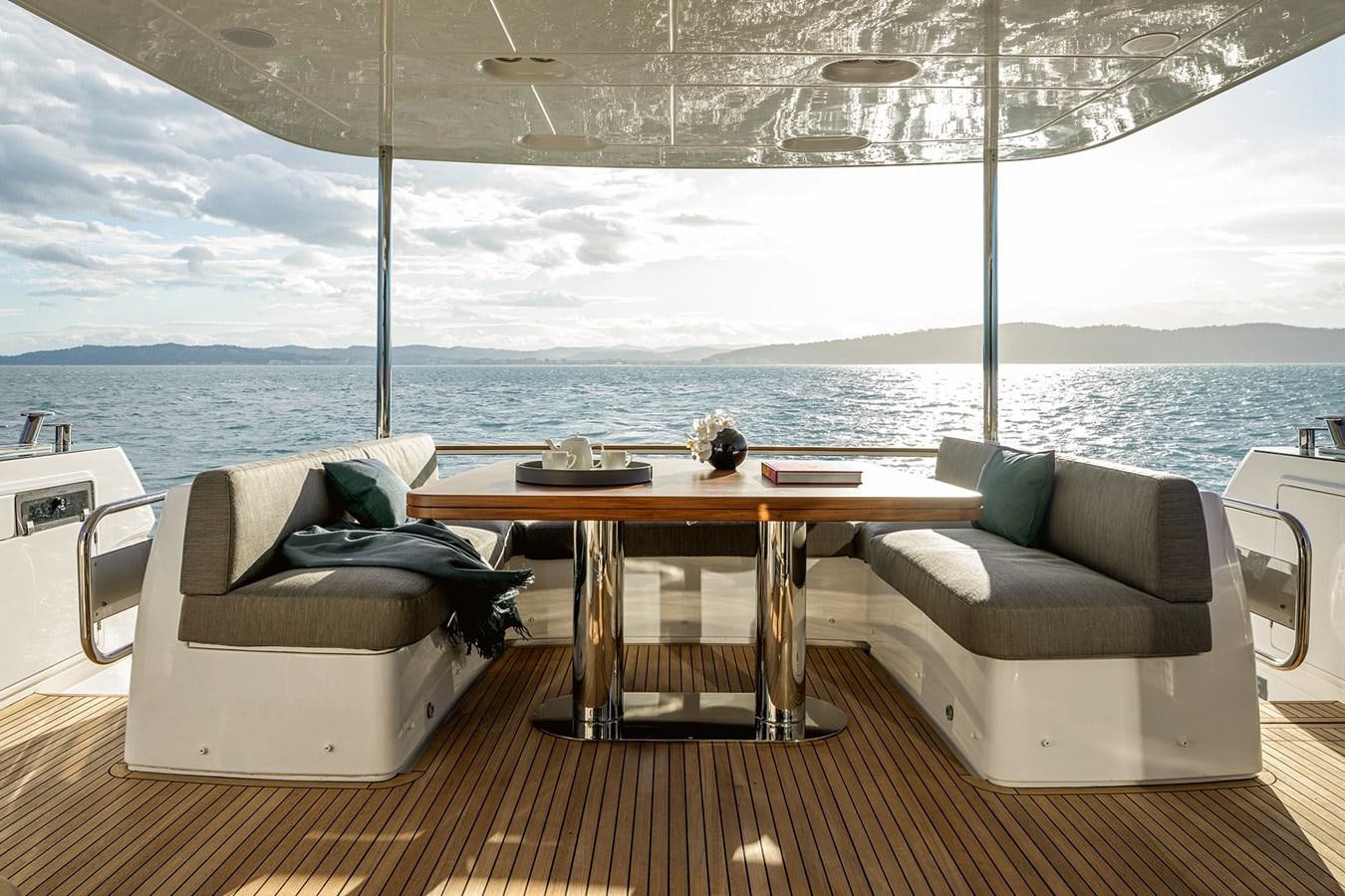 a room with a table and chairs aboard 66 MAGELLANO Yacht for Sale