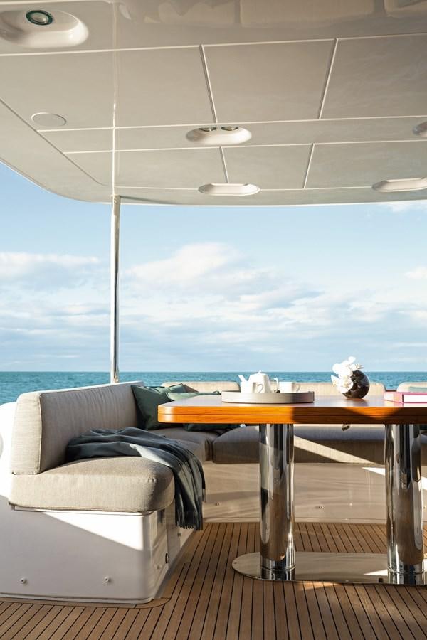 a room with a table and chairs aboard 66 MAGELLANO Yacht for Sale