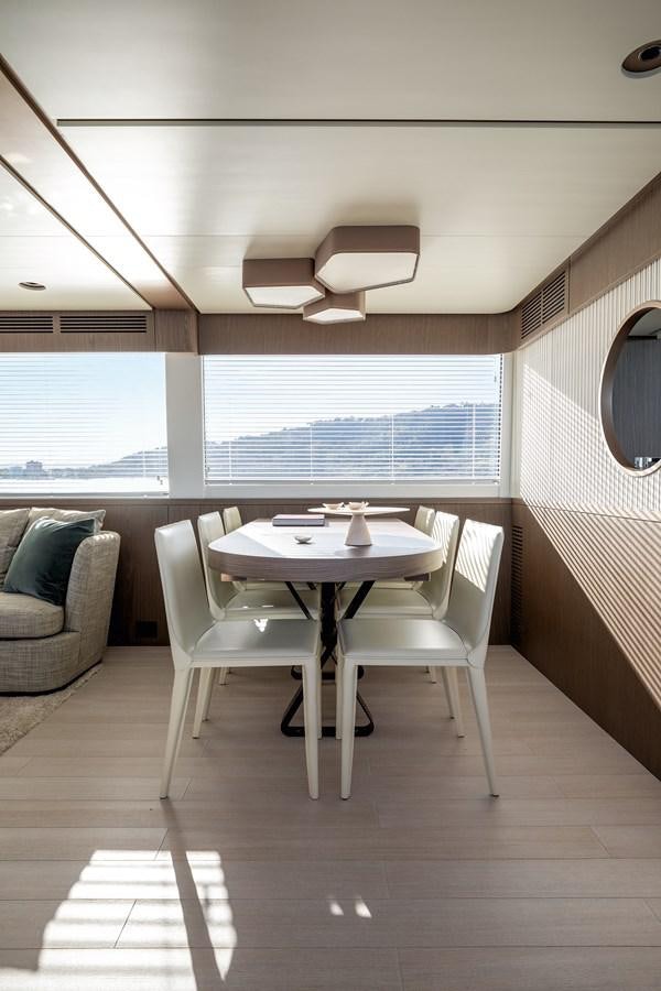 a room with a table and chairs aboard 66 MAGELLANO Yacht for Sale