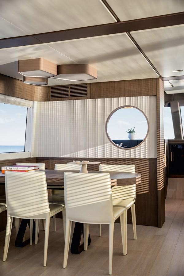 a room with a table and chairs aboard 66 MAGELLANO Yacht for Sale