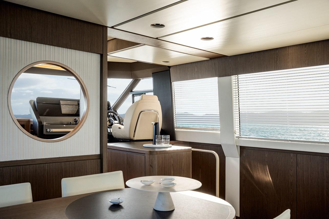 a room with a table and chairs aboard 66 MAGELLANO Yacht for Sale