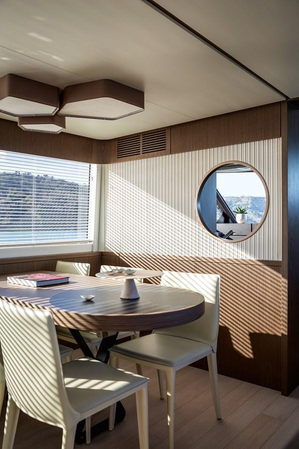 a room with a table and chairs aboard 66 MAGELLANO Yacht for Sale