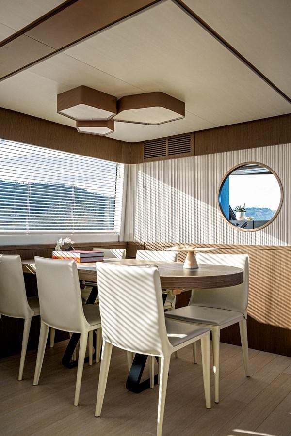 a room with a table and chairs aboard 66 MAGELLANO Yacht for Sale
