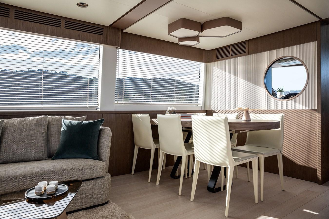 a living room with a couch and a table aboard 66 MAGELLANO Yacht for Sale