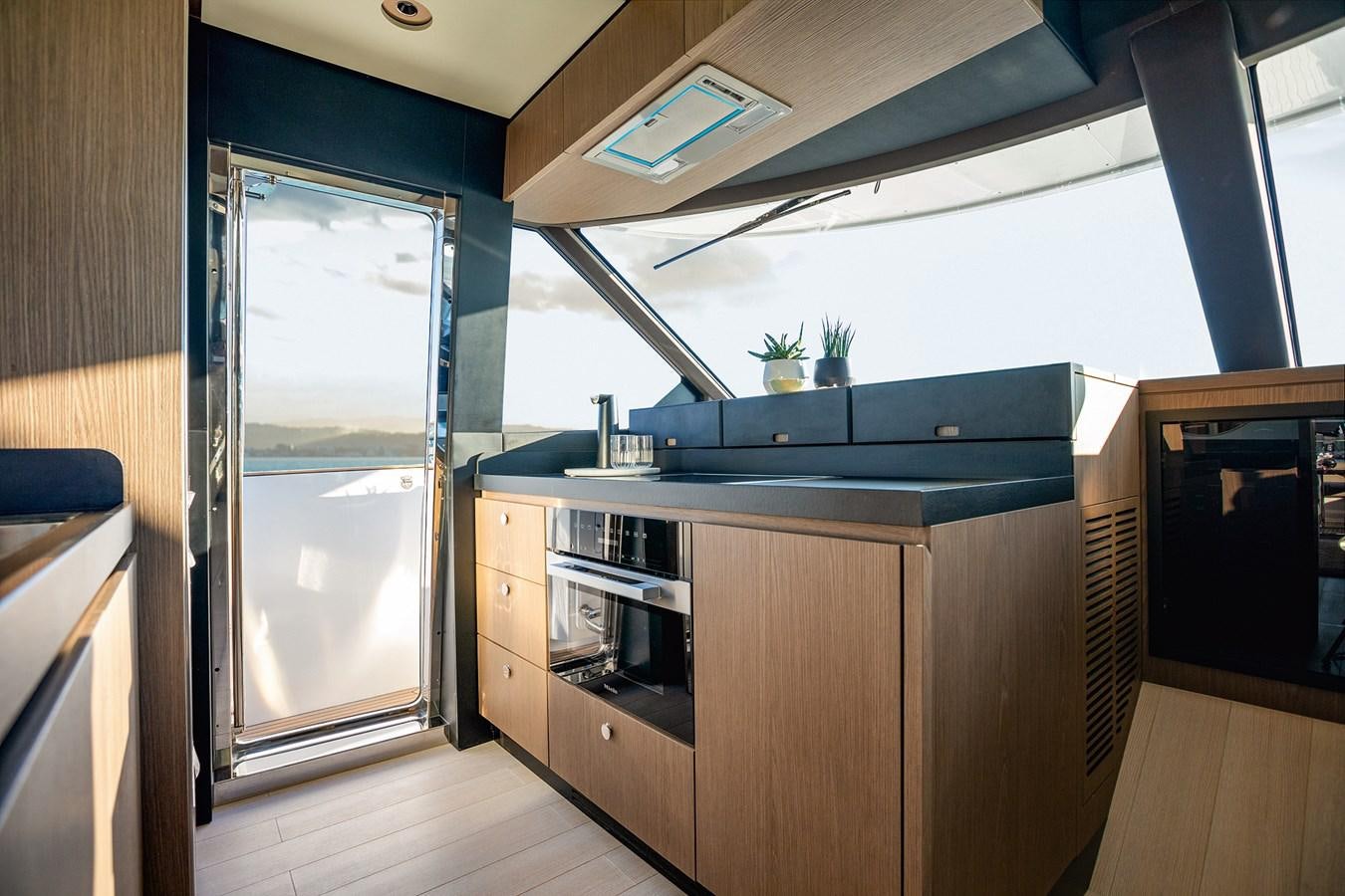 a kitchen with a large window aboard 66 MAGELLANO Yacht for Sale