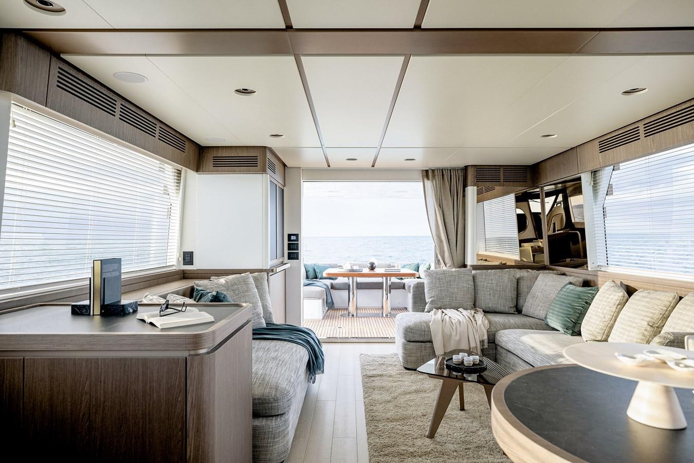 a living room with a couch and a table aboard 66 MAGELLANO Yacht for Sale