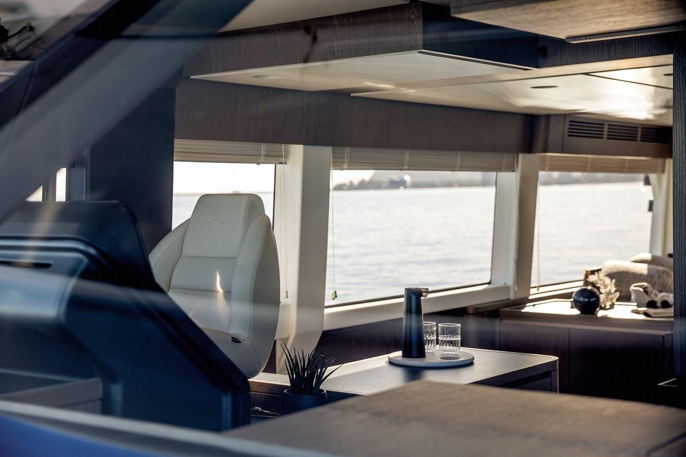 a room with a table and chairs aboard 66 MAGELLANO Yacht for Sale