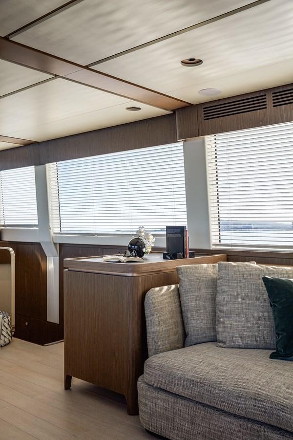 a living room with a couch and a desk aboard 66 MAGELLANO Yacht for Sale