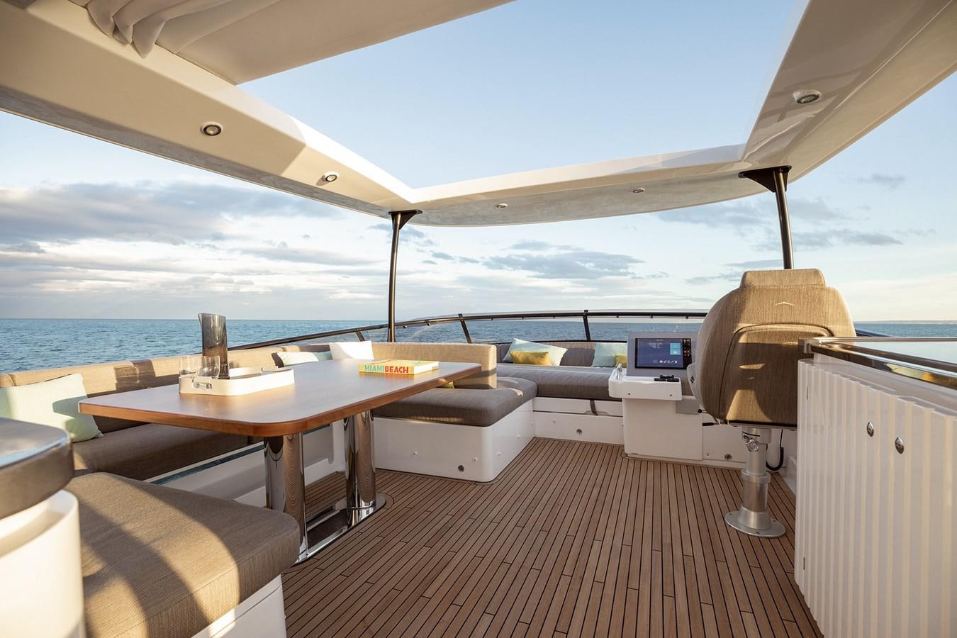 a room with a table and chairs aboard 66 MAGELLANO Yacht for Sale