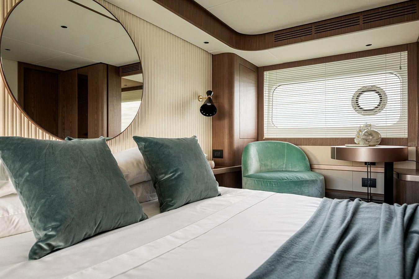 a bed with a white sheet and pillows aboard 66 MAGELLANO Yacht for Sale