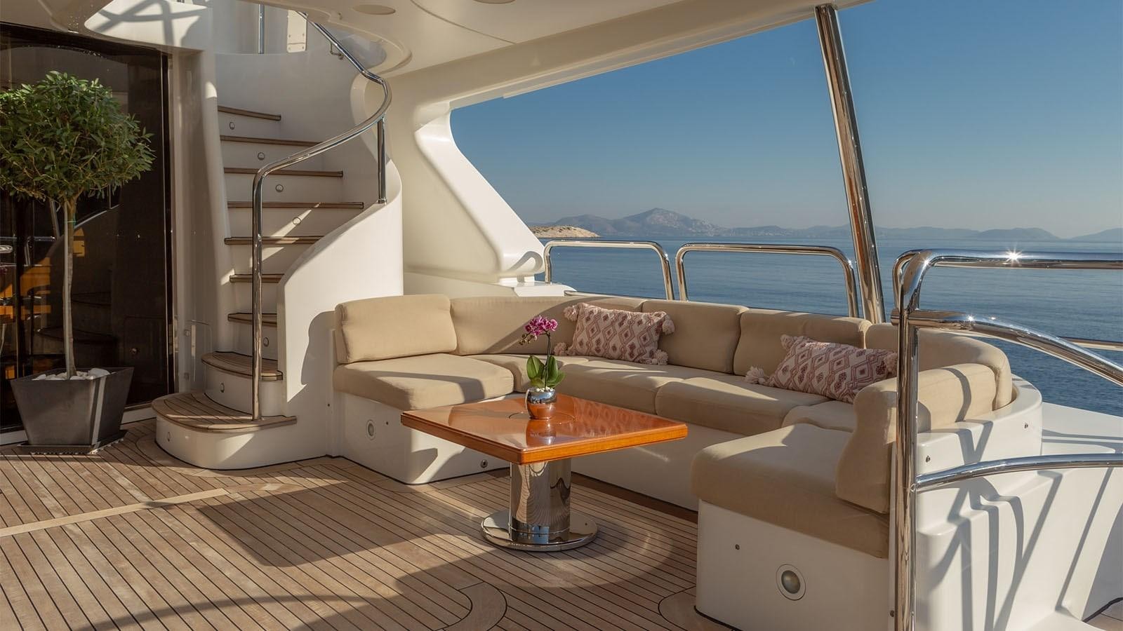 a living room with a large balcony aboard RIVA I Yacht for Sale