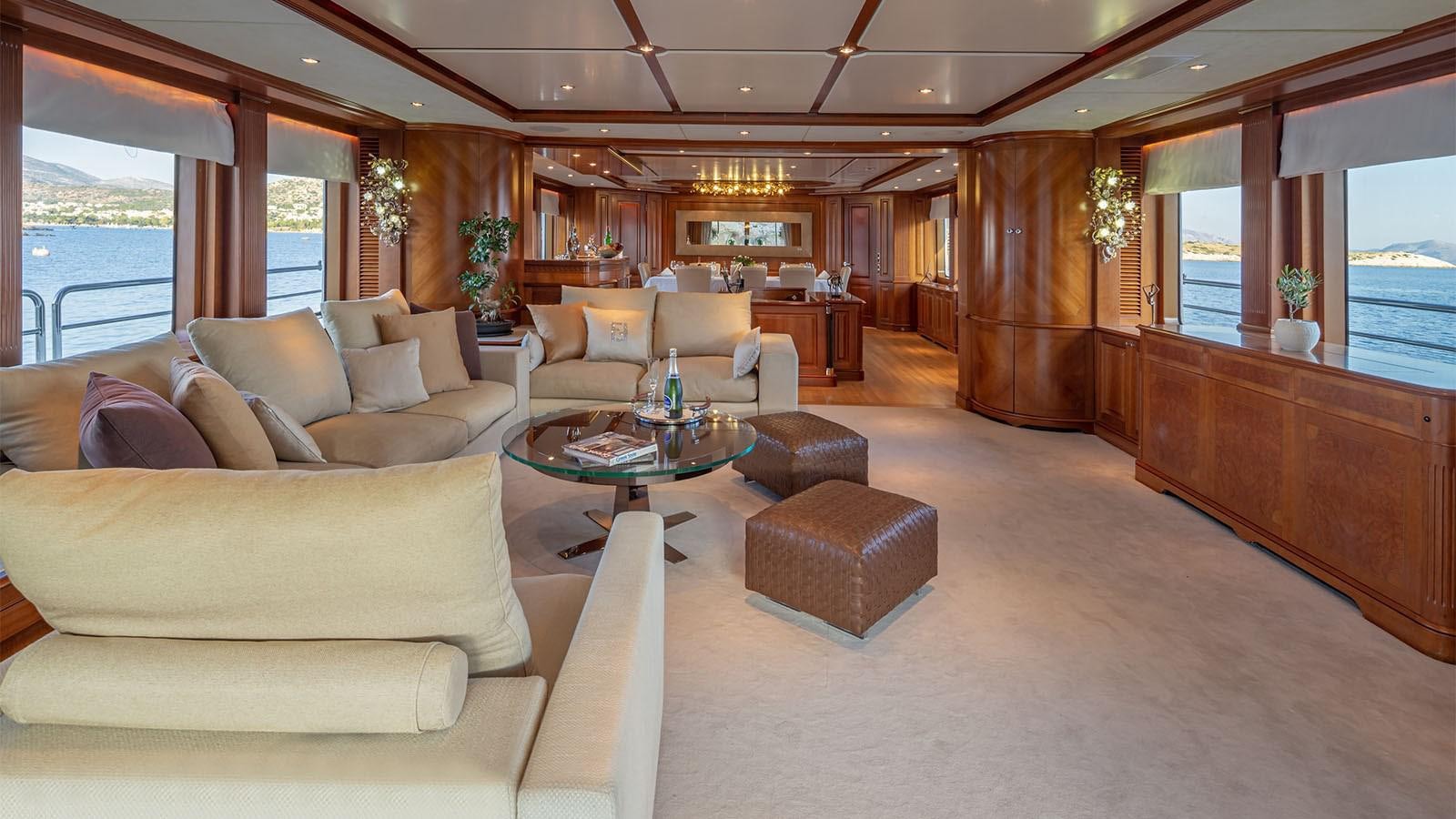 a living room with a couch and a coffee table aboard RIVA I Yacht for Sale