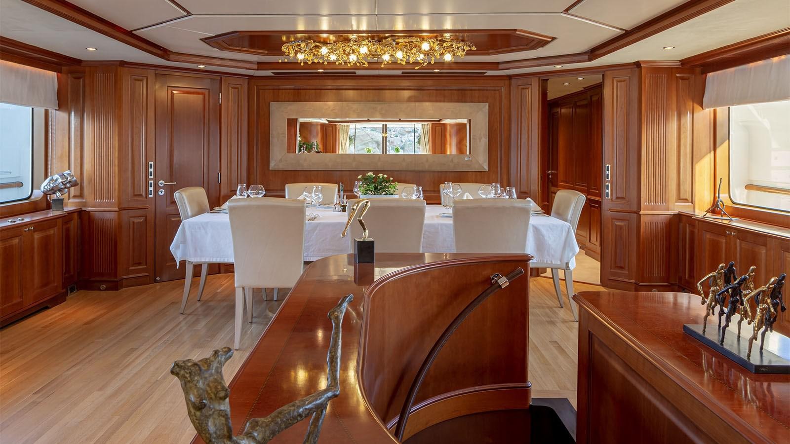 a large dining table in a kitchen aboard RIVA I Yacht for Sale