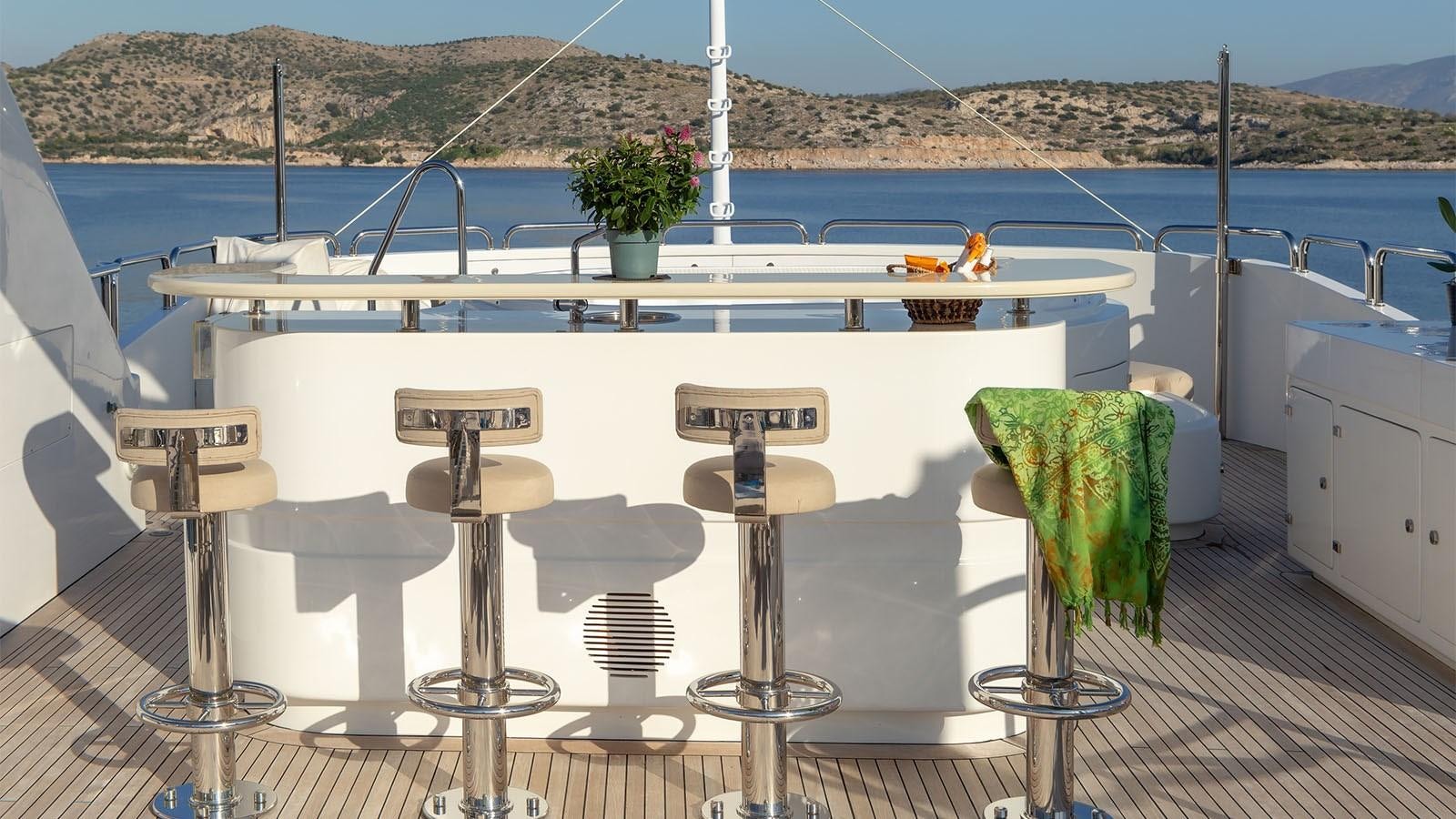 a table with chairs on it aboard RIVA I Yacht for Sale