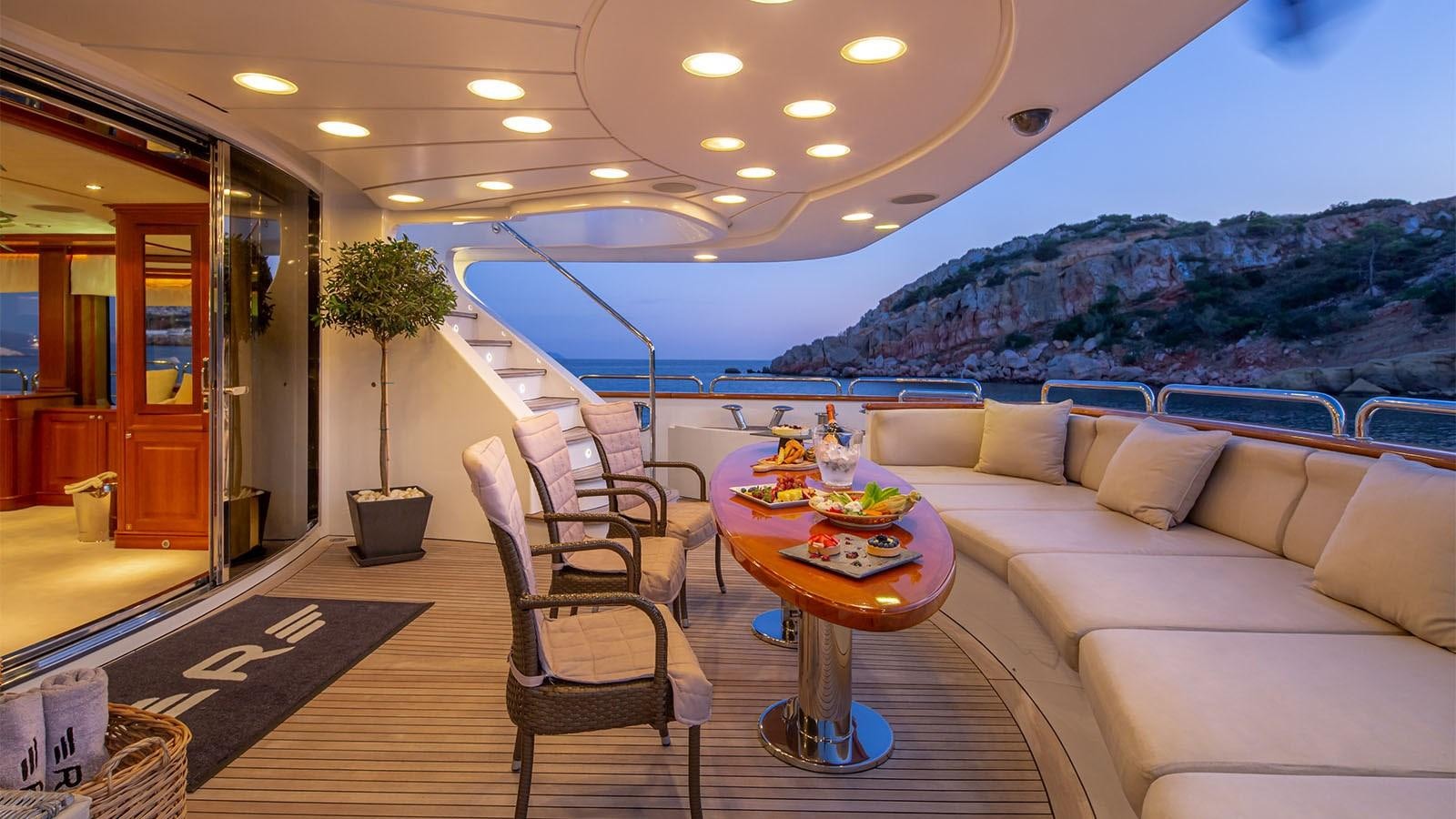 a living room with a couch and a table aboard RIVA I Yacht for Sale