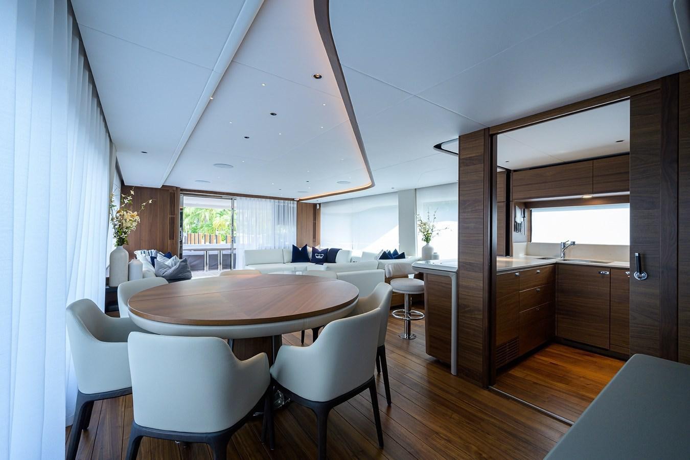a dining room with a table and chairs aboard ESCAPE Yacht for Sale
