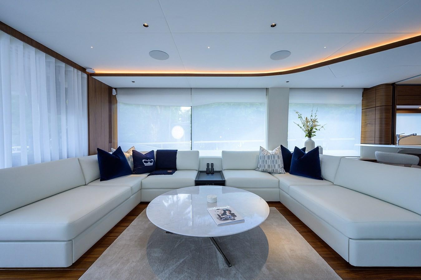 a living room with a couch and a table aboard ESCAPE Yacht for Sale