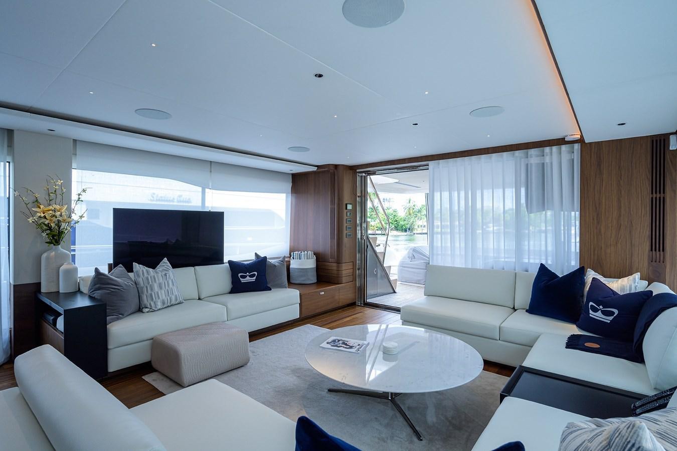 a living room with a large window aboard ESCAPE Yacht for Sale