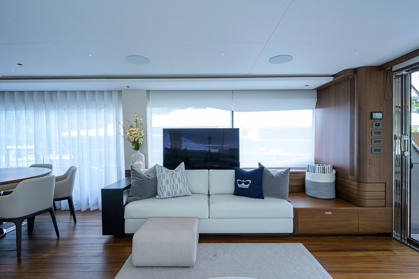 a living room with a large window aboard ESCAPE Yacht for Sale