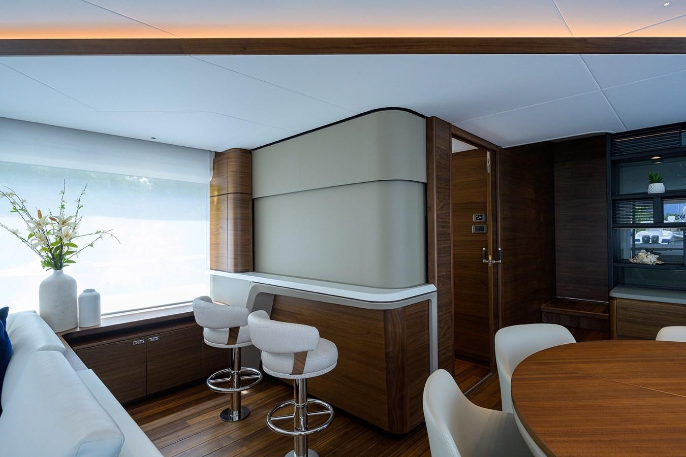 a room with a table and chairs aboard ESCAPE Yacht for Sale
